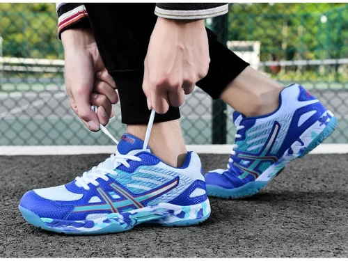 Sportowe buty halowe typu unisex z niebrudzącą gumową podeszwą, idealne do treningów na hali oraz codziennych aktywności sportowych dla kobiet i mężczyzn.